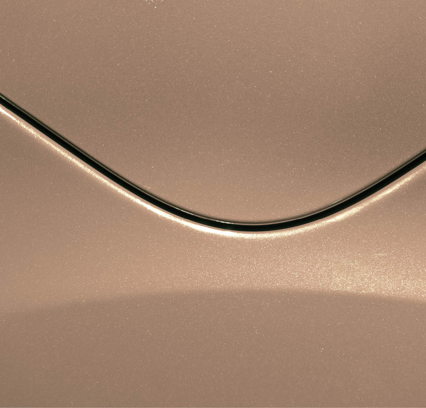 Smooth curves of bright yellow metal car body. Abstract - steel post envelope.