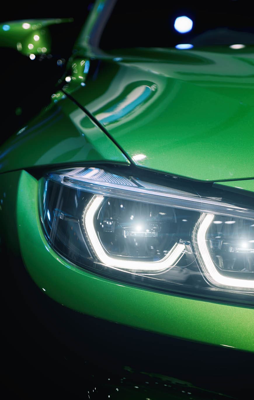 Closeup headlights of modern car during turn on light in night.