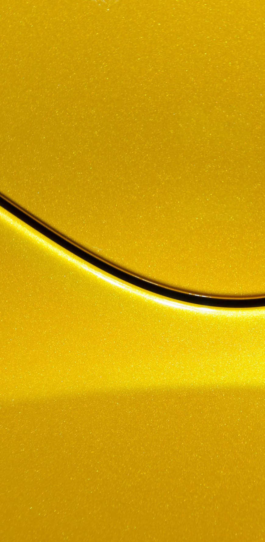 Smooth curves of bright yellow metal car body. Abstract - steel post envelope.