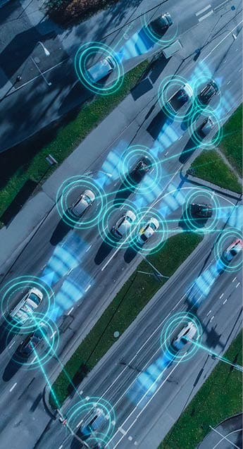 Top Down Aerial Drone: Autonomous Self Driving Cars Moving Through City. Concept: Artificial Intelligence Scans Surrounding Environment, Detecting Cars, Avoids Traffic Jams and Drives Safely.